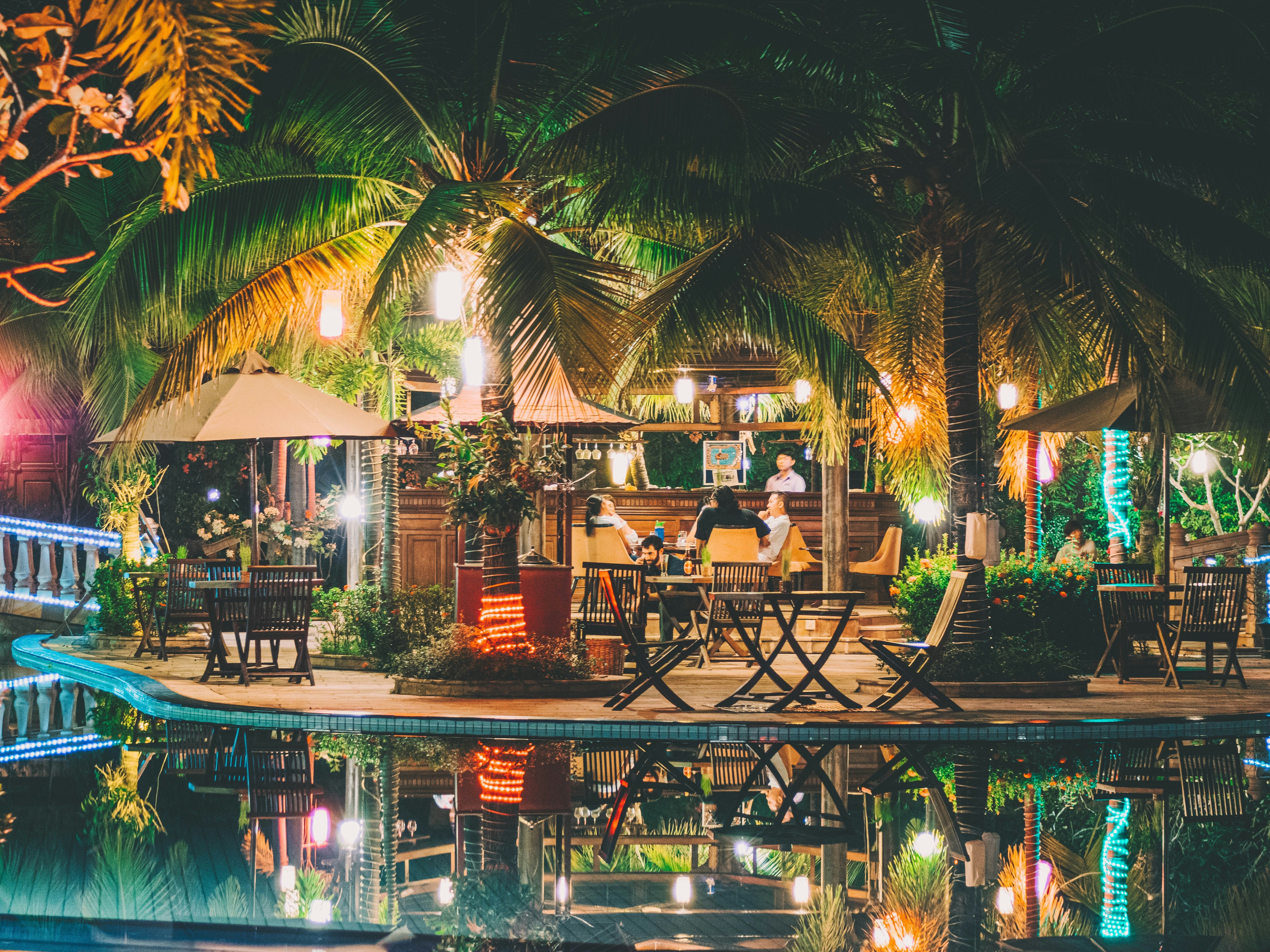 An outside hut at night, serving drinks